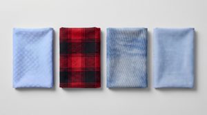 Flat lay of four shirt fabrics — oxford, flannel, denim and chambray — showing their different weaves and textures.