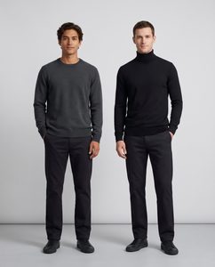 Side-by-side full-body shot of two male models wearing a crewneck and a turtleneck sweater