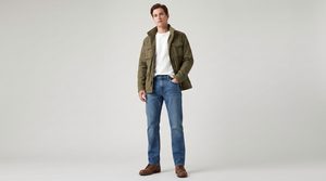 Full-body shot of a male model in straight-leg jeans, a heavyweight tee, and a utility jacket, fall outfit formula