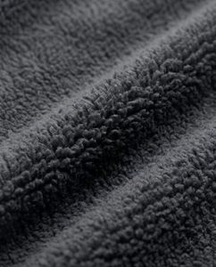 Close-up macro of a hoodie's fleece interior showing the fluffy brushed texture