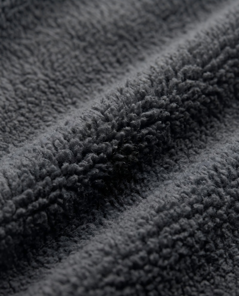 Close-up macro of a hoodie's fleece interior showing the fluffy brushed texture